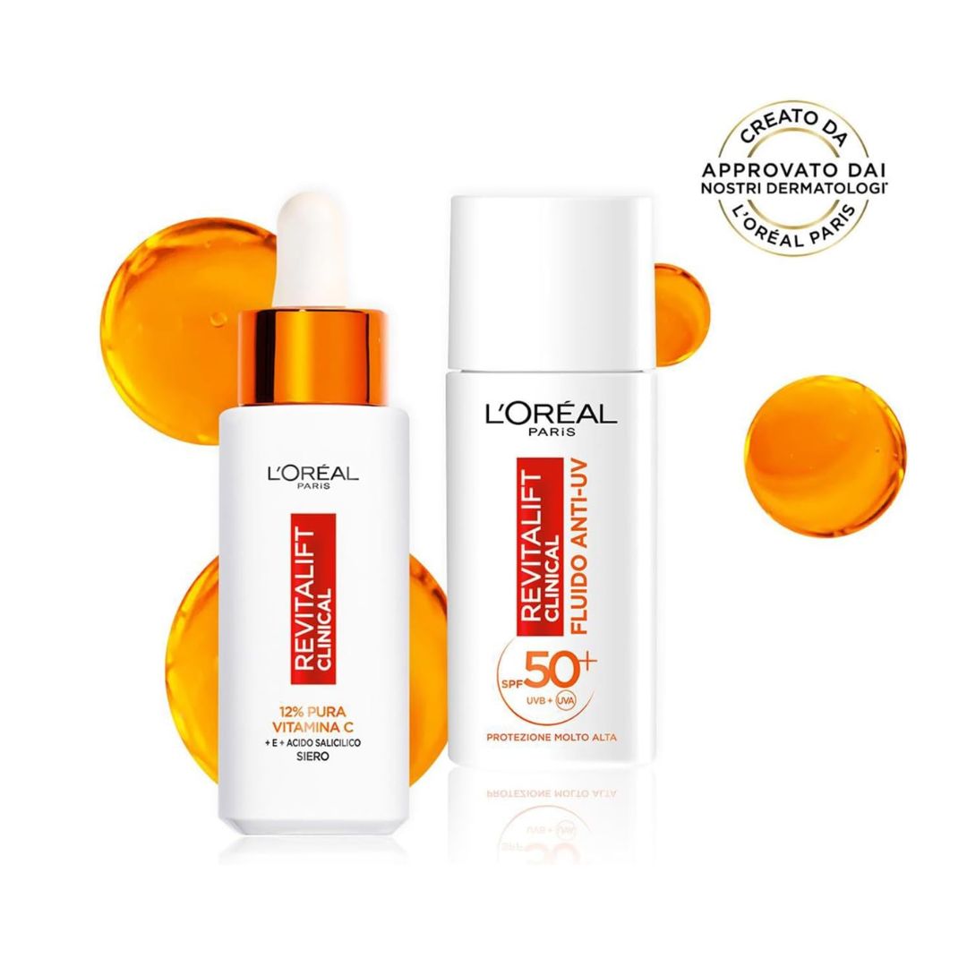CONFEZIONE REVITALIFT CLINICAL CON POCHETTE- Fluido anti-uv 50+ + siero viso